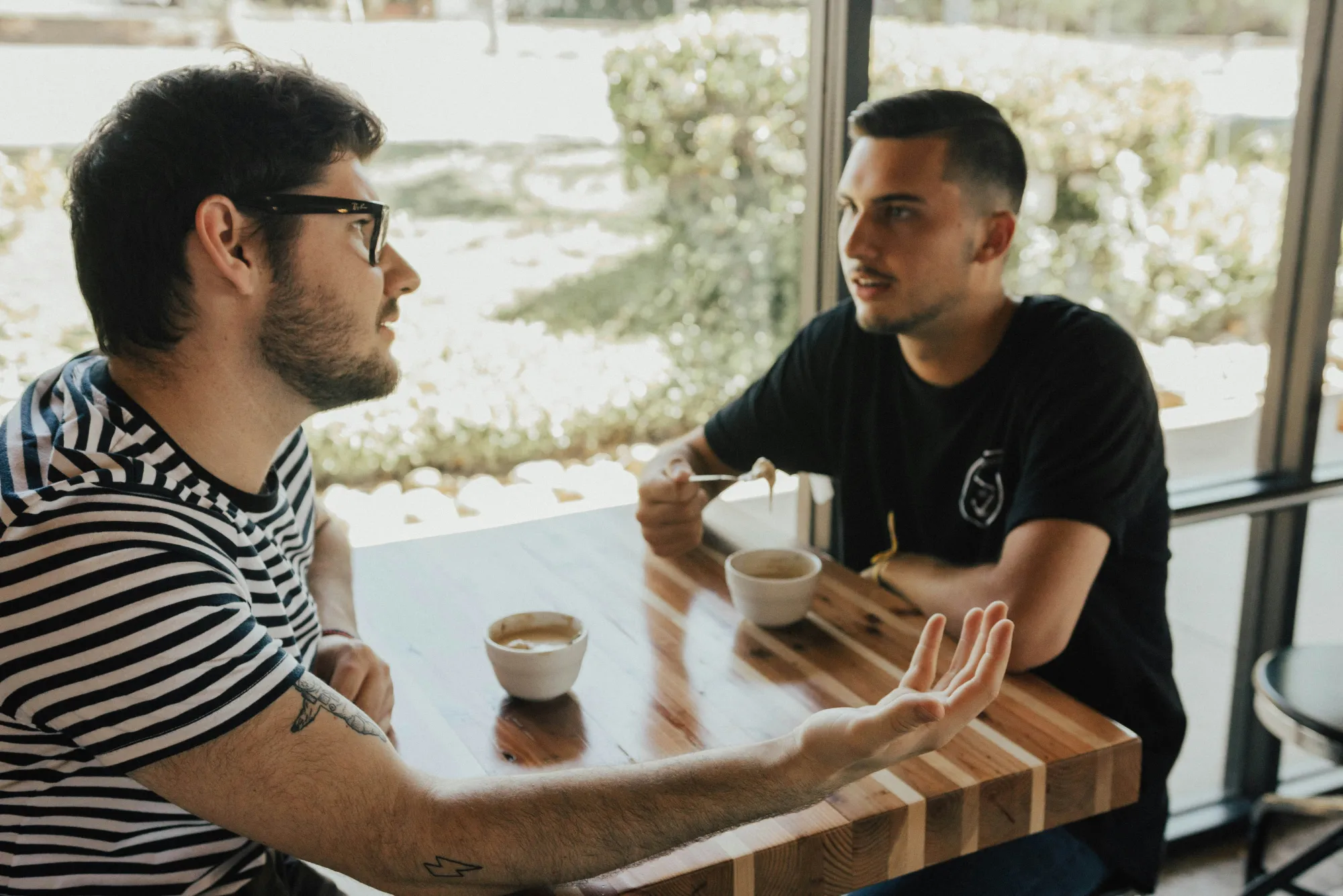 Two people having a conversation at a table